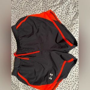 Black and orange under armour running shorts.